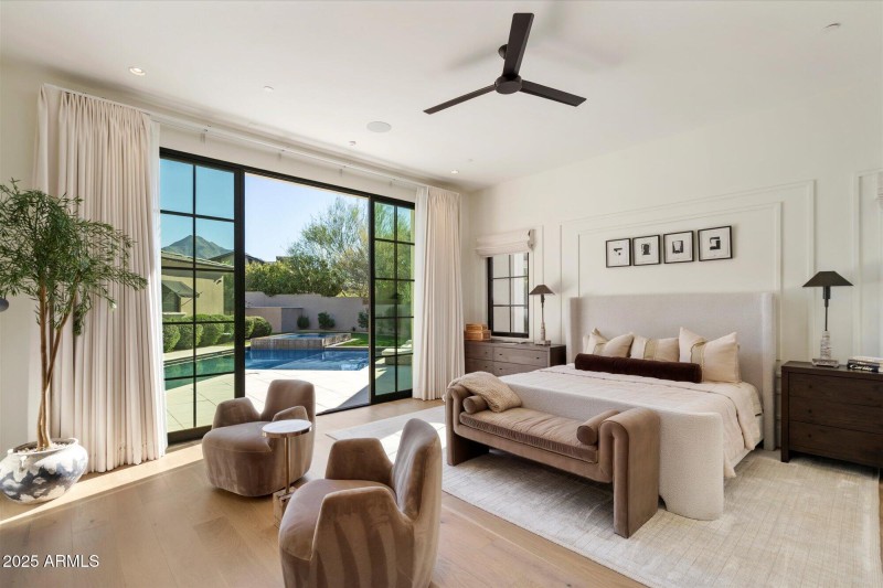 Spacious primary suite with glass wall