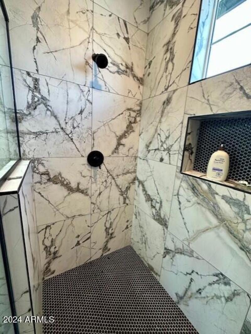 inside of master shower SUPER spacious