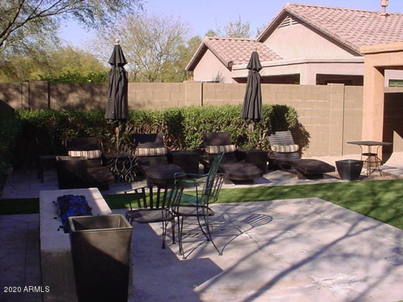 Outside fireplace and chaise lounges