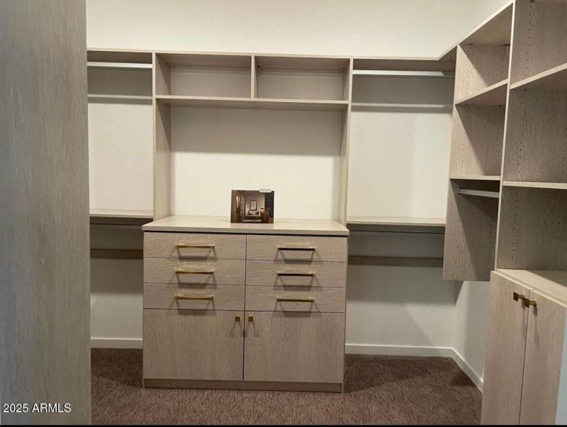 Huge Master Closet with Custom Cabinets