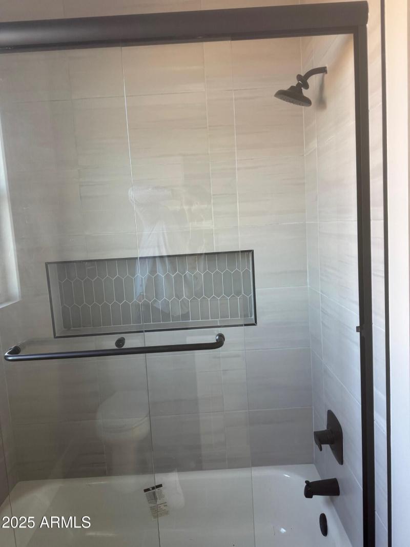 28304 showing off guest bath tile work