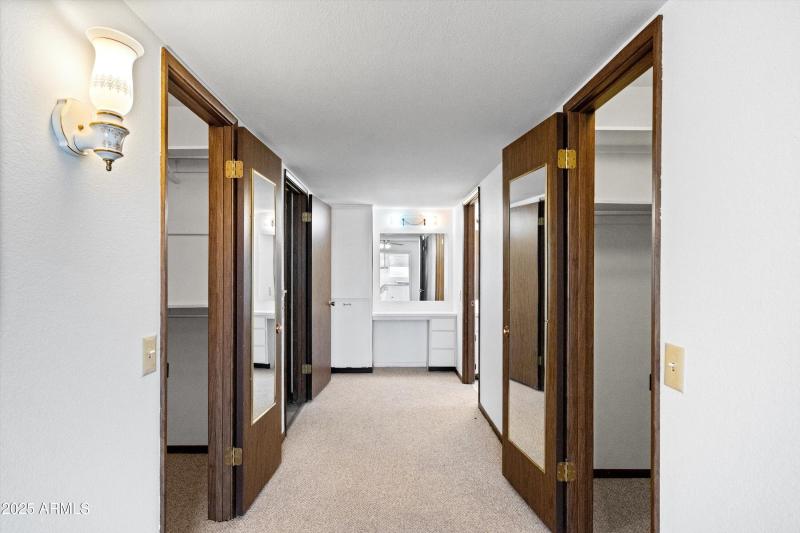 27-Primary Bedroom Closets to Bath