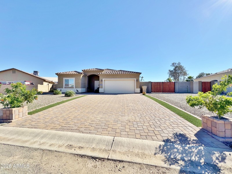 Front of home with RV gate and parking