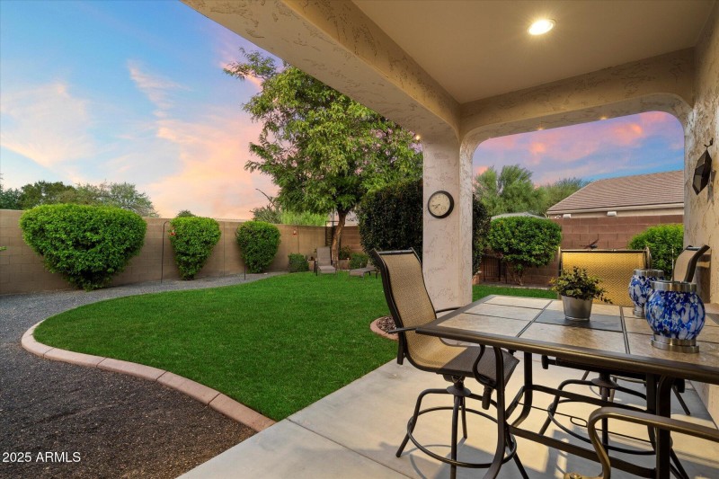 Covered Patio & Lush Lawn