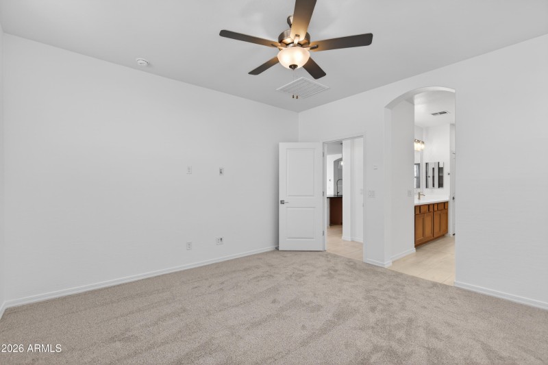 11) PRIMARY BEDROOM