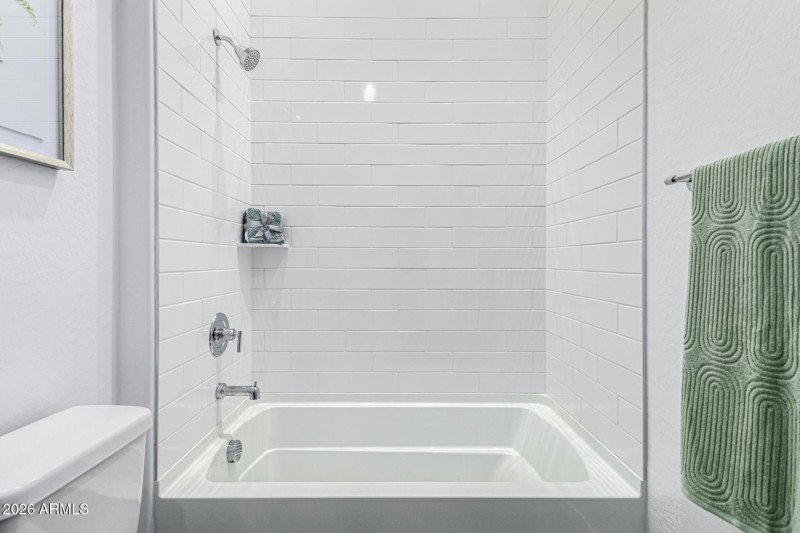 Tall Shower with Tile Backsplash