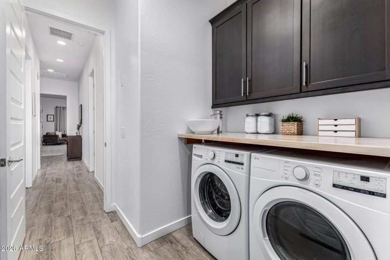 Inside Laundry Room with Upper Cabinets