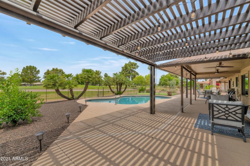 COVERED PATIO W ROLL DOWN SUN SHADES