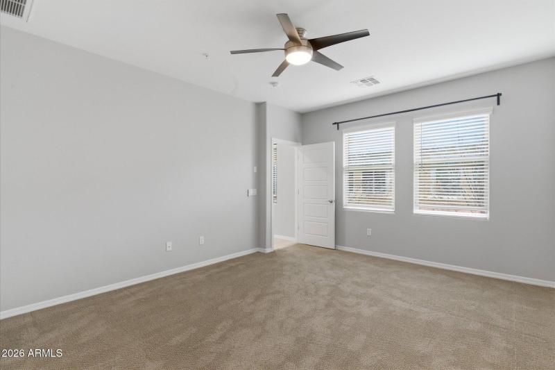 Primary Bedroom to Large Windows