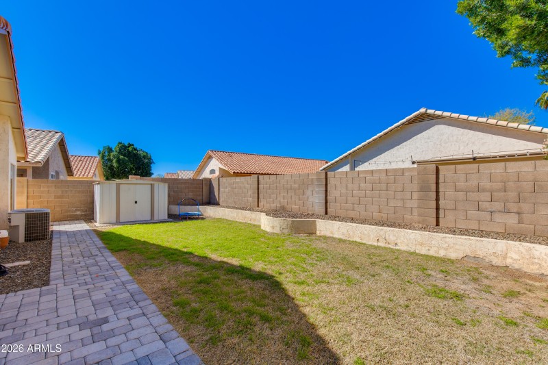 Grass Backyard with Raised Beds