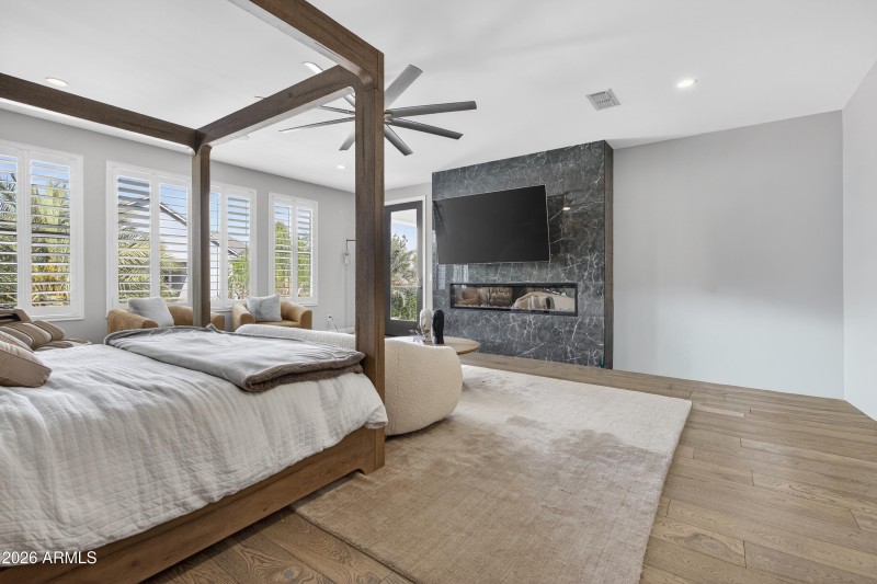 Primary suite with TV and fireplace