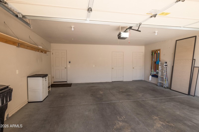Garage has hobby/storage room