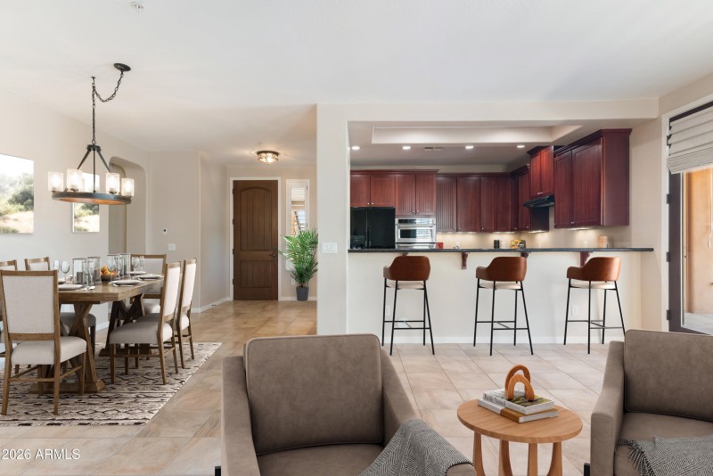 View of kitchen from great room staged