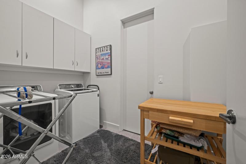 Laundry Room adjoins to Primary Closet 1