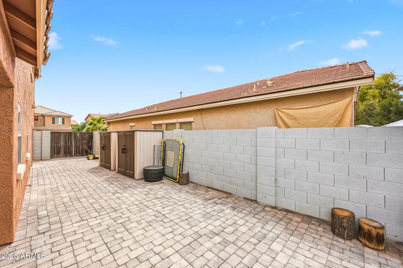 Paved Side Yard and Extended Gate