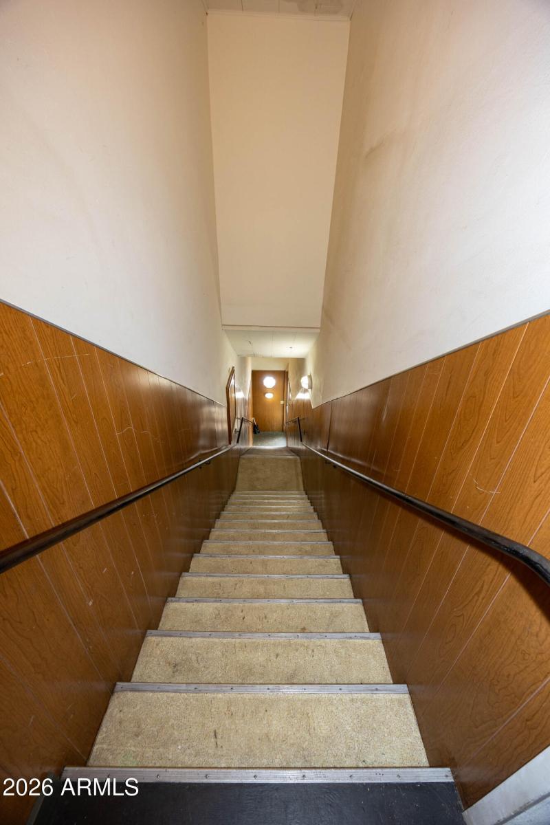 view going downstairs from tenant space