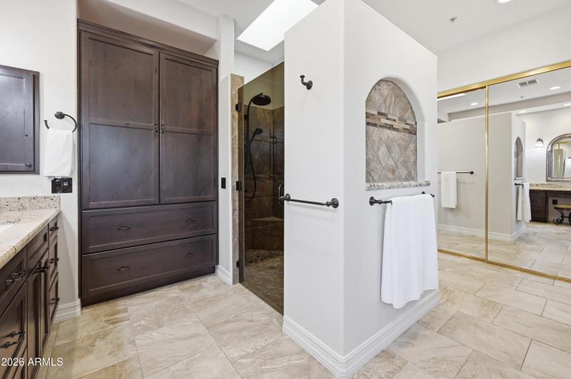 Built in linen closet and custom shower