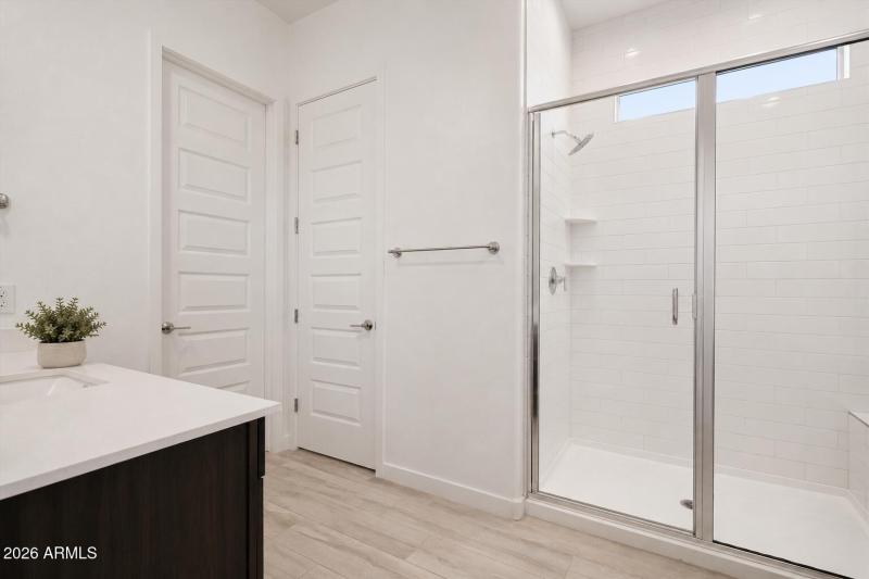primary bathroom with separate vanities