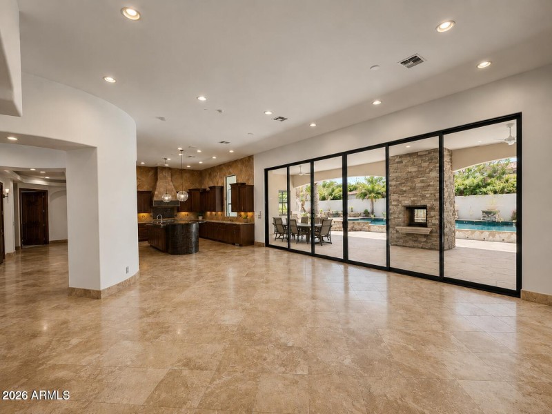 Family Room/ Fireplace view into Kitchen