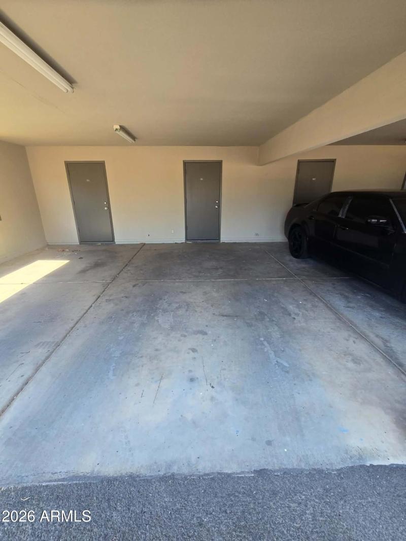 Covered parking spot with storage room