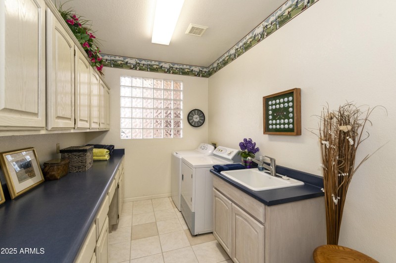 Laundry Room with cabinets/sink