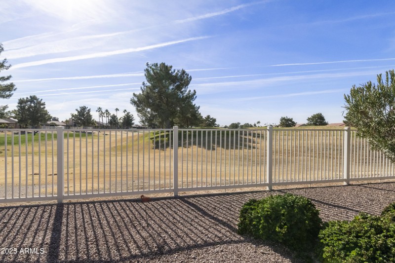 Backyard fence along golf course