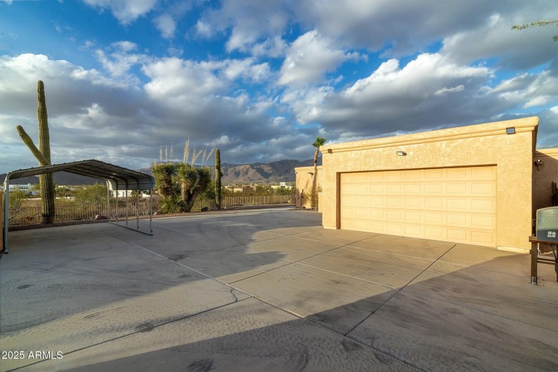 Fourth car garage behind electric gate