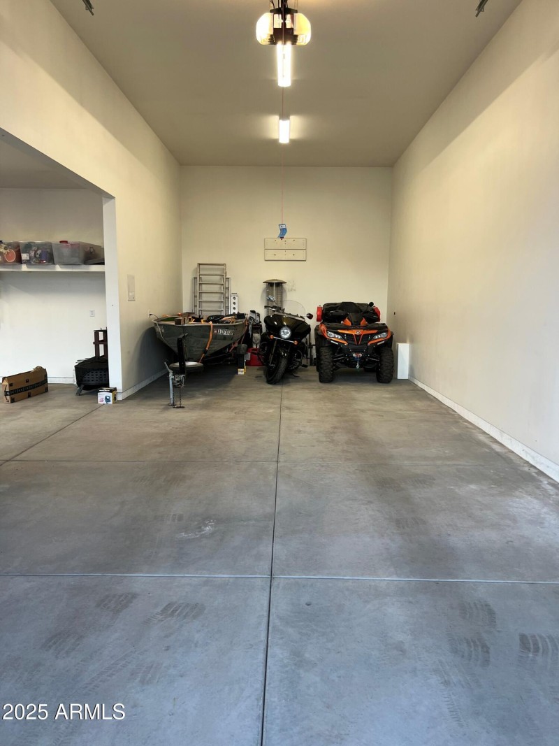 Boat, motorcycle and quad in rv garage