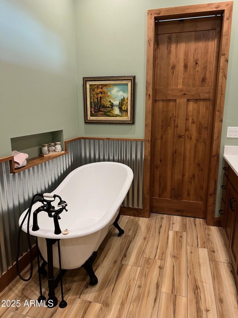 Free standing claw foot tub in master ba