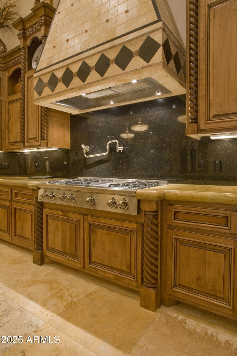 Commercial cooktop with pot filler