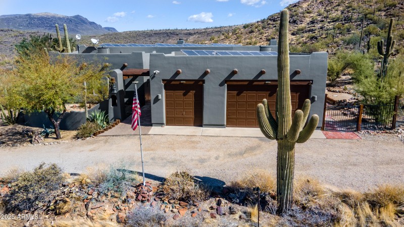 aerial of front of home with cactus revi