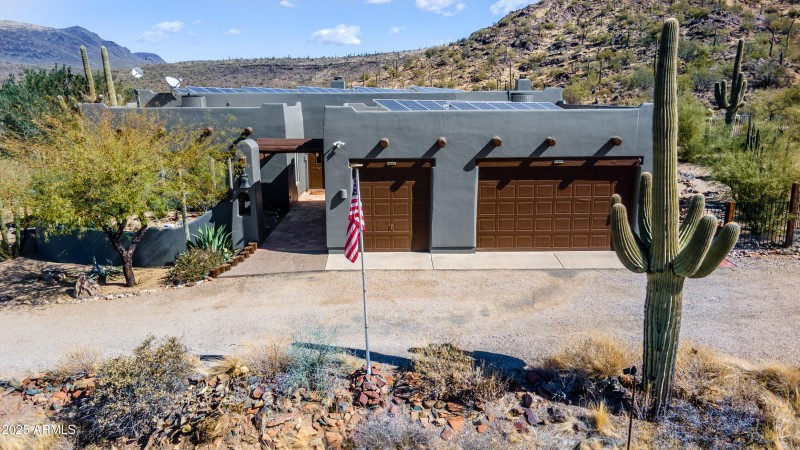 aerial of front of home with saguaro on