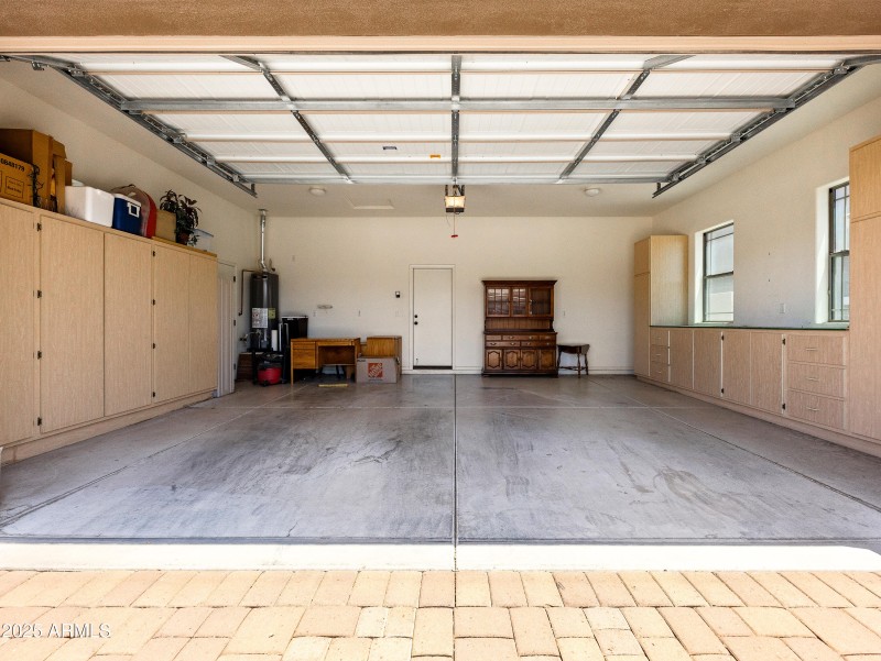 Spacious Garage with Cabinets and Work
