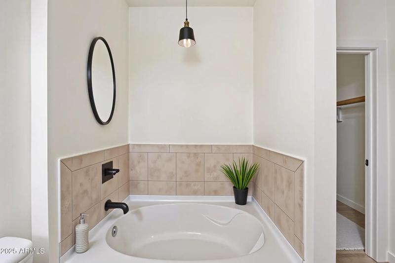 PRIMARY BATH TUB DIGITALLY STAGED