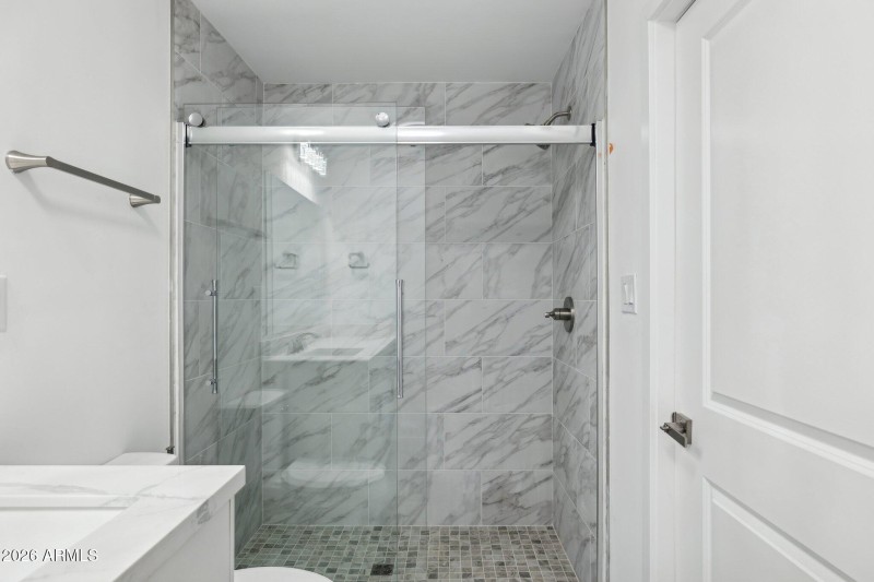 Glass Shower with Tile Walls