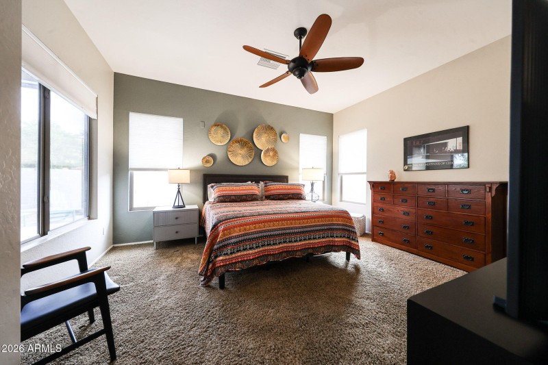 PRIMARY BEDROOM IN BACK OF HOME