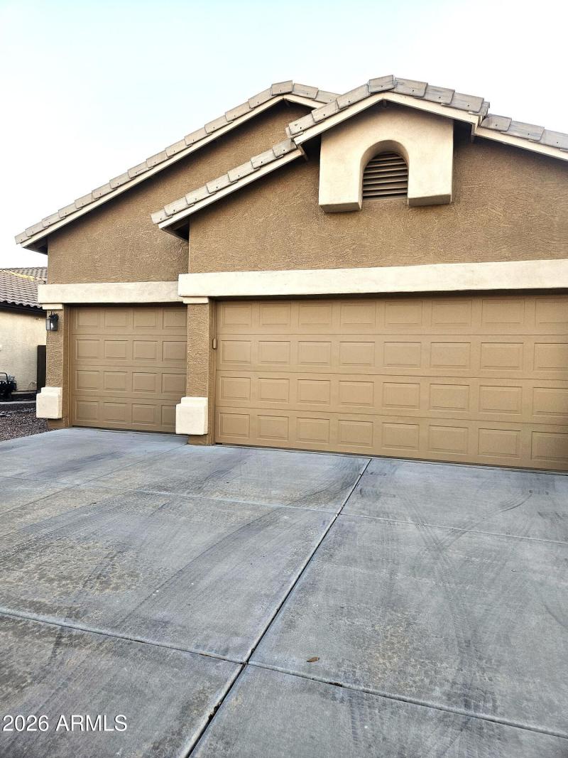 Three car garage with cabinets in 85339.