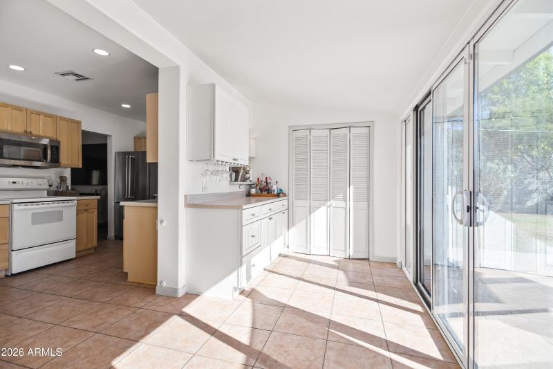 DINING RM WITH SERVING BAR + LAUNDRY