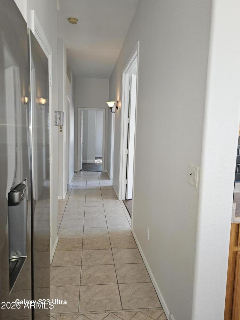 VIEW OF HALL WAY TOWARD SECONDARY BRs.