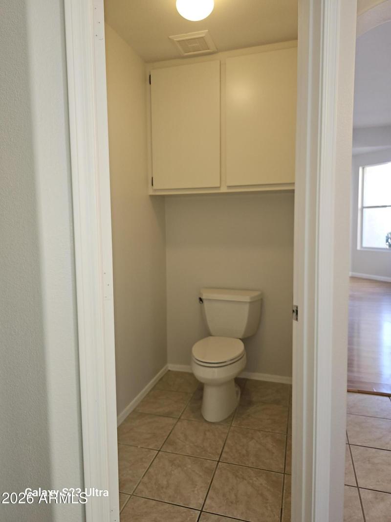 private closet w/ cabinet