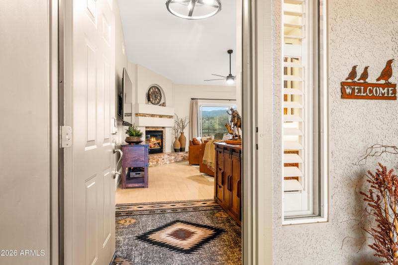 Entryway to Fireplace and Living Room