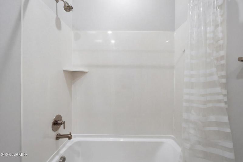 Tub Shower & Neutral Tile