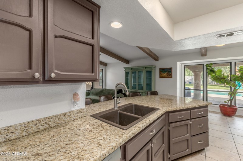 kitchen leading to pool view
