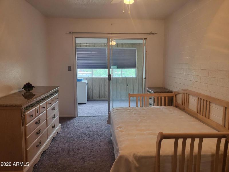 EXIT TO ENCLOSED BALCONY