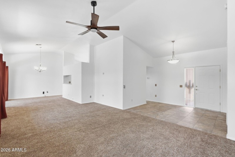 Entryway, living area to dining